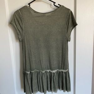 NWT. Cute top with ruffle hemline